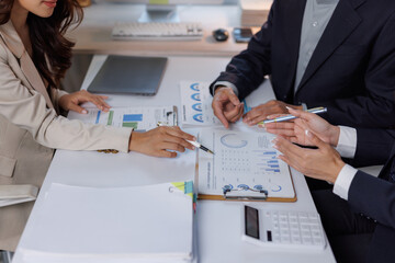Business professionals analyzing financial data during meeting