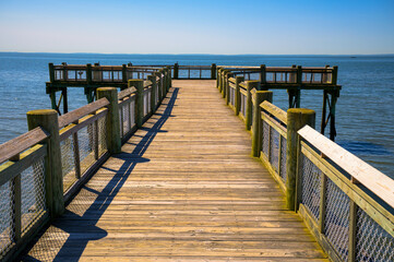 Wooden pier extending into the water at Albert L. Munroe Sr. Pier in Milford, Connecticut