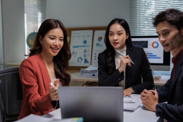 Business team collaborating on strategy reviewing data