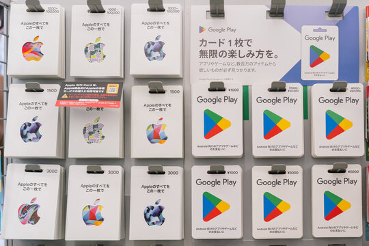 OSAKA, JAPAN - FEB 12, 2025: Apple and Google Play gift cards in a retail store.