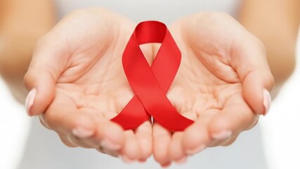 Doctor with Red Ribbon for World Aids Day, National Red ribbon week. Healthcare and world cancer day