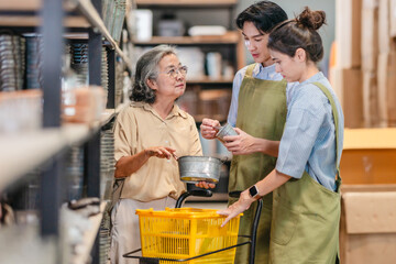 Mother and Family Business Owner Teaching About Material Production and Recycling