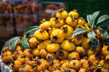 Colorful display of rosa roxburghii fruits at Chengdu market