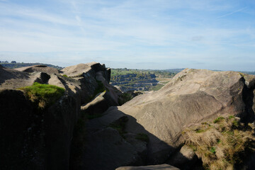 Rugged Gritstone Rock Formations At Black Rocks Viewpoint Offering Panoramic Views Over A Large Working Quarry And Surrounding Derbyshire Countryside Near Cromford.