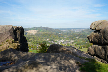 Panoramic View From Black Rocks Showing A Valley With A Town, Autumn Trees, And Distant Hills In Cromford, Derbyshire Under A Bright Blue Sky.