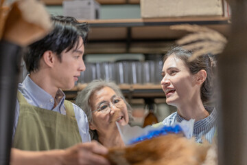 Mother and Family Business Owner Teaching About Material Production and Recycling