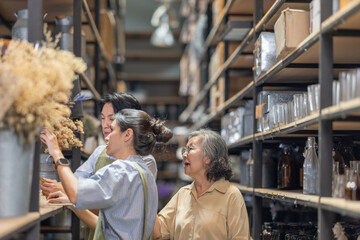 Mother and Family Business Owner Teaching About Material Production and Recycling