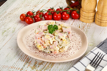 Russian traditional Olivier salad with sausages