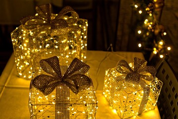 Christmas decorations with golden, bright packages.