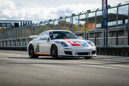 Brno, Czech Republic - October 10, 2025: Porsche 911 GT3 Clubsport 997 racing car. The sports car drives on a racing circuit.