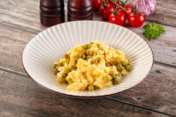Scrambled egg omelet with green peas