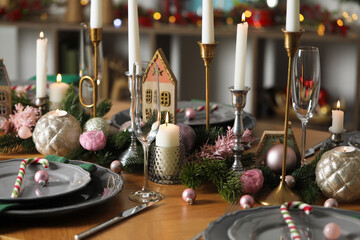Festive table setting with Christmas decor at home, closeup