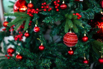 Merry x-mas,Close up of Colorful balls ,gifts box and Christmas greeting picture parcel,bell decoration on Green Christmas tree background Decoration During Christmas and New Year.