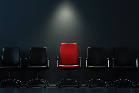 A striking red chair stands alone among black chairs in a dimly lit space, symbolizing individuality, uniqueness, and the courage to stand out in a regular environment.