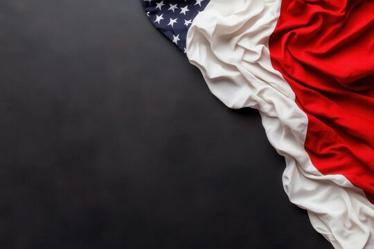A beautifully arranged American flag and Texas flag draped over a textured black surface, highlighting the relationship between patriotism and state pride.