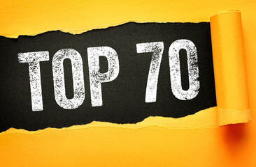 TOP 70 message displayed on torn paper with bold distressed letters. Creative typography layout ideal for ratings, rankings, countdowns, popular lists and milestones