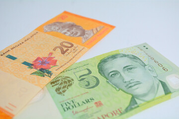 20 ringgit Malaysia and 5 Singapore dollar banknotes