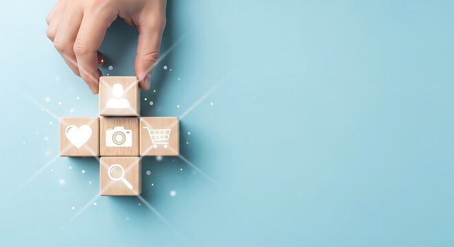 Hand placing wooden block with user icon on blue background concept