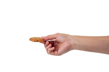 Cookies sprinkled with grains in hand on transparent background