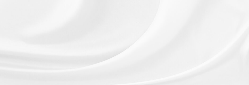White gray satin texture that is white silver fabric silk panorama background with beautiful soft blur pattern natural.