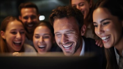 Excited group of people celebrating success with laughter and joy in a modern office environment