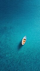 Aerial View of a Small Sailboat Floating in Crystal Clear Waters with Stunning Blue Tones