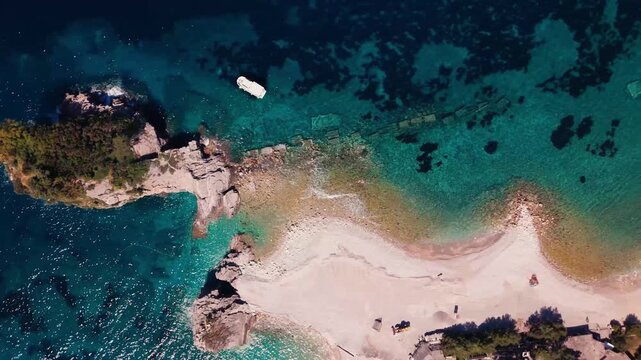 Top Down Slow Reveal of Island Shoreline and Isolated Structure