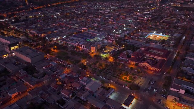 Aerial view of the city of Ovalle at night with lights and cars with lights, dim purple light, northern Chile, Limar&iacute; Valley