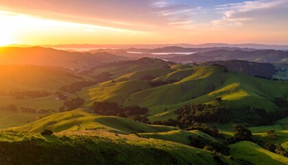 Golden sunrise over rolling hills with nature landscape.
