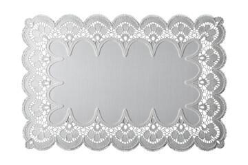 High-contrast white lace doily on black backdrop