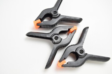Obraz premium Construction clamps close-up on a white background