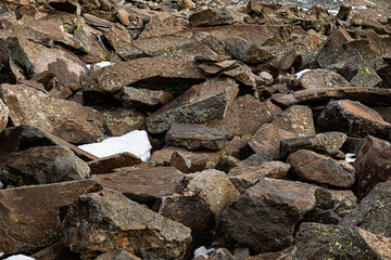 A pile of rocks with snow on top