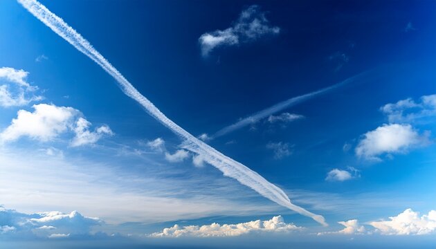 Blue Sky With White Clouds And Contrail