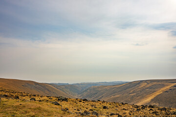 A desolate landscape with a cloudy sky