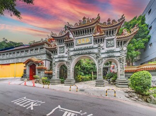 Traditional temple gate in Taipei with ornate carvings at sunset