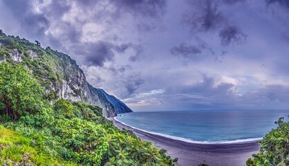 Dramatic Taiwan coastline with steep cliffs and blue sea