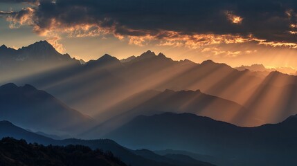 Stunning mountain range bathed in dramatic golden sunbeams breaking through clouds at sunrise inspiring tranquility and adventure