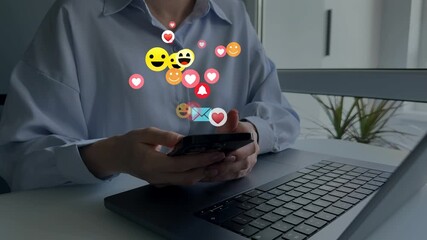 Woman using smart phone with emoticon icons of Social Media.Interactive with friends on chat with emoticon feedback.Social media,marketing, like,social network,blog,live,chat reaction and livestream. - Powered by Adobe