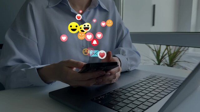 Woman using smart phone with emoticon icons of Social Media.Interactive with friends on chat with emoticon feedback.Social media,marketing, like,social network,blog,live,chat reaction and livestream.