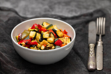 Grilled vegetables on plate with spices and herbs