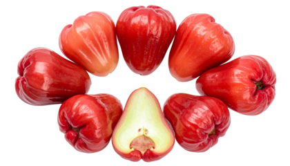 Vivid close-up of rose apples arranged in a circle, one sliced open, on a black background