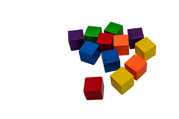Obraz premium Colorful wooden toy cubes scattered on transparent background