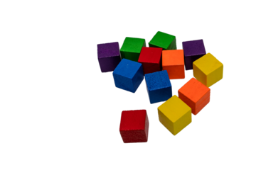 Colorful wooden toy cubes scattered on transparent background