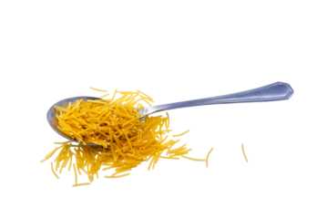 Uncooked pasta strands on a metal spoon