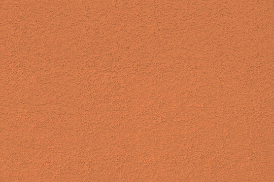 Coral red pink stucco wall texture, peach fuzz color background. Abstract artistic backdrop for design. Salmon color, pastel orange plaster, exterior wall building texture pattern