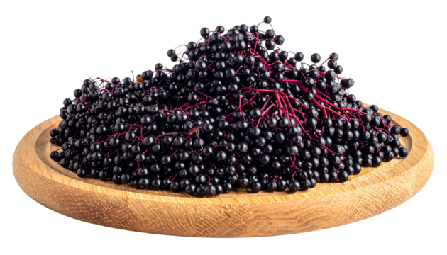 A wooden platter displays a generous heap of dark, small, round berries with red stems