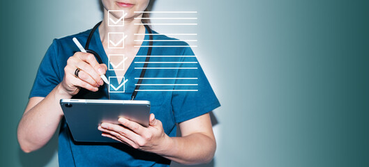 The doctor fills out a digital checklist on the screen to maintain medical records and improve...