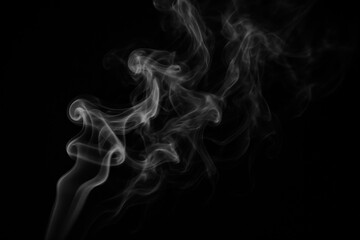Obraz premium Artistic swirls of smoke against a black background, evoking mystery and depth. Concept of fluidity, transformation, and the ephemeral nature of existence.