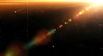 Abstract lens flare and light leak effect with dust particles on a dark background, cinematic and vintage feel