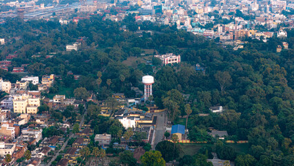 Obraz premium Top down Buildings and Apartment with Multiple Building aerial. Urban Buildings and Apartment at bridge road at Delhi. Cinematic cityscape drone shot. Noida Buildings.
